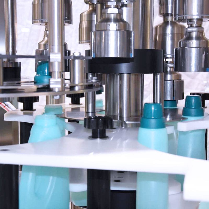 chemical-packaging-line-filling Chemical packaging line filling industrial liquids into containers