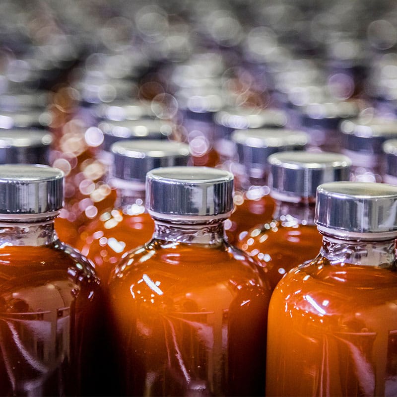 cosmetics-packaging-line-filling Cosmetics packaging line filling creams and lotions into bottles