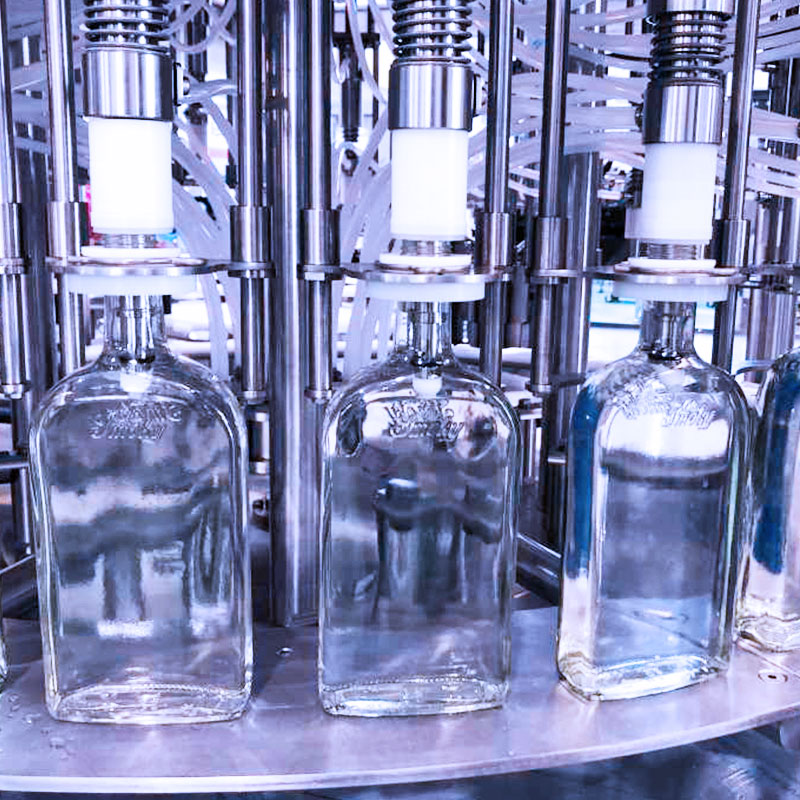 Liquid filling machine — volumetric and gravimetric filling system integration