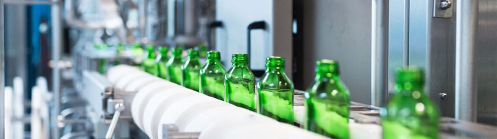 packaging-line-integration-conveyor-bottles-nvps Automated packaging line — bottle conveying system integrated by NVPS for industrial production